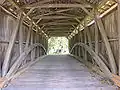 The Burr arch truss design on the inside of the bridge