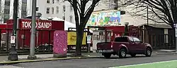 View of the food cart pod from across the street, 2025