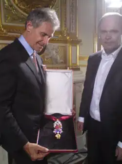 The recreated great Golden Fleece of Louis XV, presented by H. Horovitz (left) and François Farges&nbsp;[fr] (right) at the Hôtel de la Marine, formerly the royal Storehouse in Paris, on June 30, 2010.