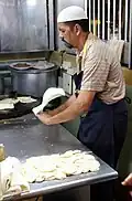 Roti prata being prepared