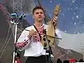 A boy playing the folk string instrument gadulka