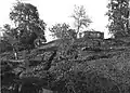 View of the ruins and the Lumbini pillar from the South