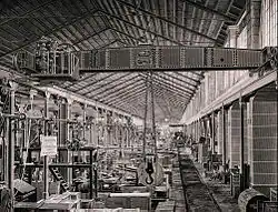 Example of steam powered overhead crane from 1875, produced by Ludwig Stuckenholz AG, Wetter an der Ruhr, Germany. Design developed by Rudolf Bredt from an original installation at Crewe railway works[1]