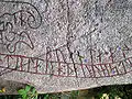 Detail showing text written outside of the serpent.