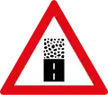 Unpaved road surface ahead