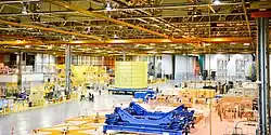 Space Launch System inter-tank section moving down the factory floor to the South VAB for vertical testing