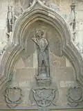 The three coats of arms of Sigismund I on west portal