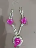 A sampaguita flower necklace purchased in the Philippines