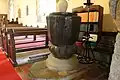 Font, carved from one piece of wood