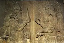 Sargon II (left) faces a high-ranking official, possibly Sennacherib his son and crown prince. 710–705 BCE. From Khorsabad, Iraq. The British Museum, London