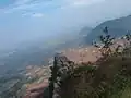 an outcrop of rock jutting to tamilnadu scenery
