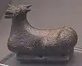 Seated bull bronze pendant