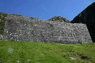 A wall in front of the Sunniva Church