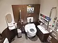Wheelchair-accessible toilet in car 12