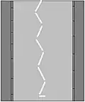 Zebra crossing ahead; keep left of the divider.
