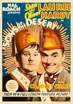 Window card with Laurel and Hardy at center, in fezzes