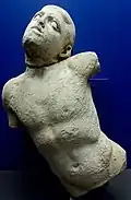 Sculpture of a man fighting a centaur.