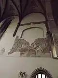 Remains of the murals above the entrance to the sacristy