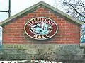 The mall's previous logo as pictured on a sign along Loudon Road