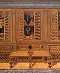 Various cabinets, doors open or ajar, filled with objects of note.