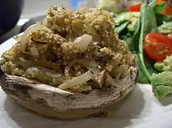 A stuffed mushroom with spiced quinoa