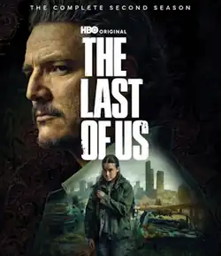 Cover art featuring Ellie with a gun in Seattle, and Joel above her