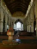 The font and nave, looking towards the chancel