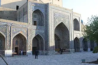 Iwan behind main entrance