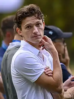 A picture of Tom Holland looking towards the camera