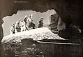 Pirates by the mouth of a cave on the island