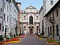 Chiesa di San Francesco Saverio (St. Francis Xavier Church). The street is via Belenzani connecting the church façade with Piazza Duomo