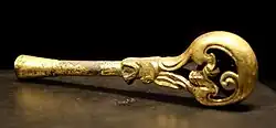 Gilded bronze tuning key for turning the pins of a guqin, China, Han dynasty, 201 BC to 221 AD.