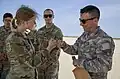 A U.S. Army second lieutenant and a Turkish Air Force NCO trade uniform patches during Defender 23