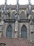 Northern façade clerestory. The upper levels of the nave are built in stone while the rest of the church is built of brick.