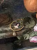 Detail of the portrait miniature showing the pearl-wrapped decolleté shawl