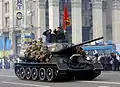 Historical troops on the T-34 tank.