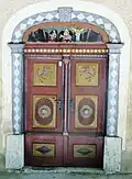 Door casing on house no. 6 with the Flight into Egypt motif