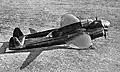 an aircraft sat on the ground, from the side