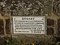 Old iron warning sign on the bridge parapet