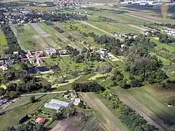 Houses in Zgorzała nad Jeziorem, alongside Trombity Street and near Zgorzała lake, in 2011.
