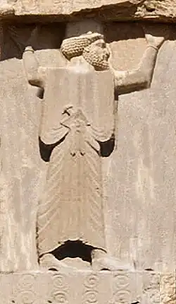 Engraving of a bearded Persian man wearing robes and a cap